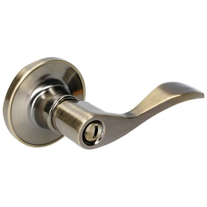 Manija tubular curva función baño, latón antiguo, llave estándar, blíster. Lock